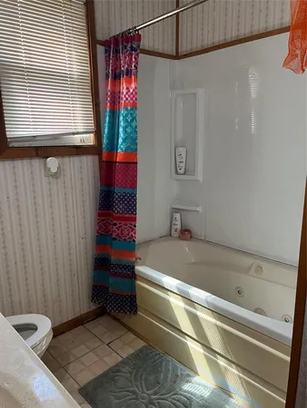 a bathroom with a sink a mirror and a shower