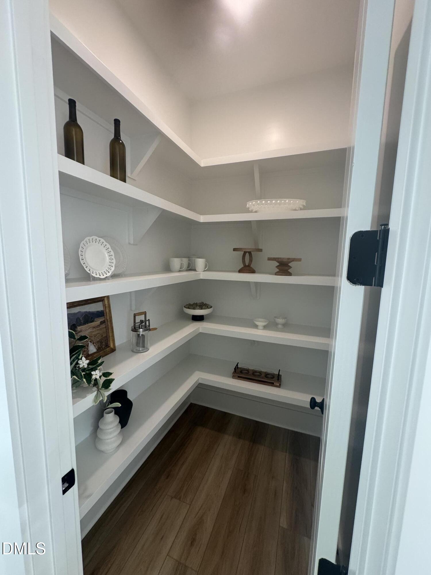 1037 Azalea Garden Circle Raleigh, NC 27603 - Photo 11 of 24 a kitchen with white cabinets and appliances