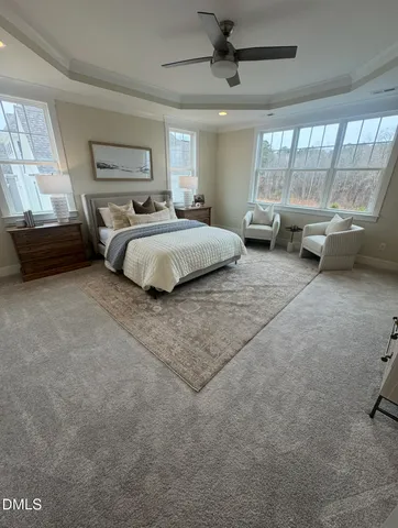 a bedroom with bed and window