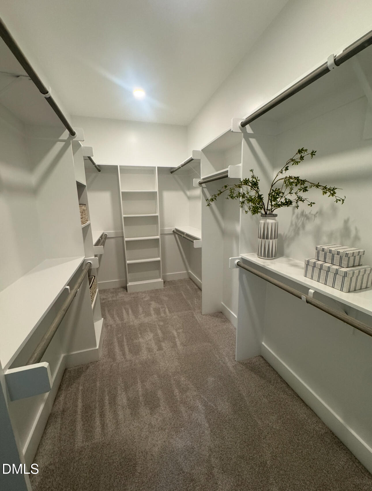 1037 Azalea Garden Circle Raleigh, NC 27603 - Photo 20 of 24 a view of walk in closet with clothes and shoes