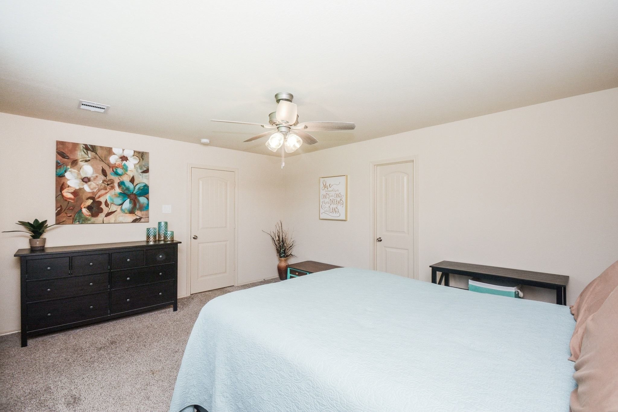 23318 Dukes Run Drive Spring, TX 77373 - Photo 27 of 41 This spacious bedroom features neutral walls, carpeted flooring, and a ceiling fan. It has a cozy and inviting atmosphere.