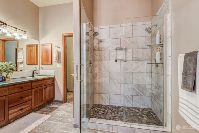 a bathroom with a shower and a sink