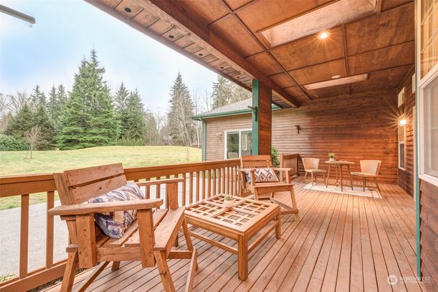 a view of a patio with wooden floor