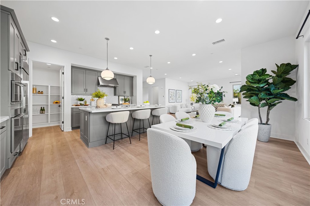 210 Sutters Mill Irvine, CA 92602 - Photo 19 of 46 a large kitchen with a table and chairs