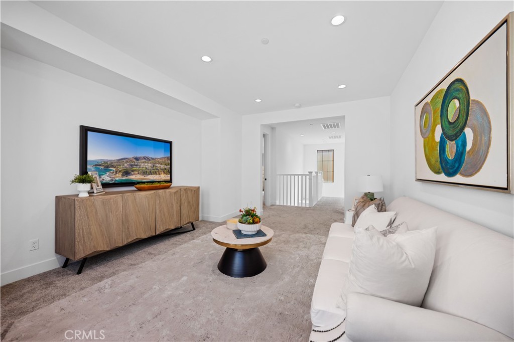 210 Sutters Mill Irvine, CA 92602 - Photo 28 of 46 a living room with furniture and a flat screen tv