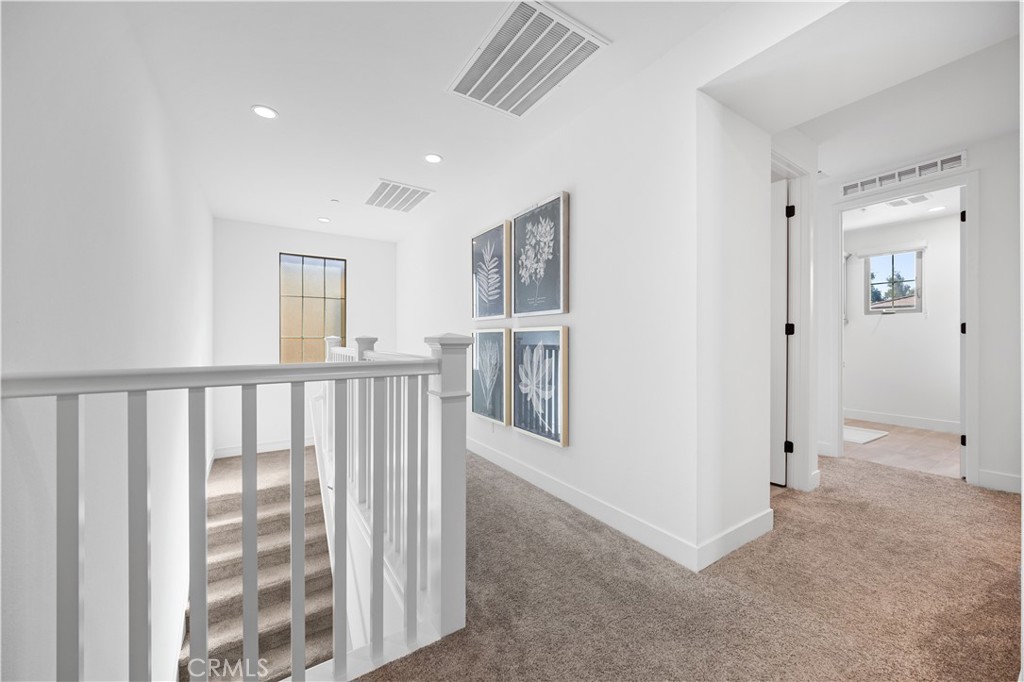 210 Sutters Mill Irvine, CA 92602 - Photo 29 of 46 a view of a hallway with workspace