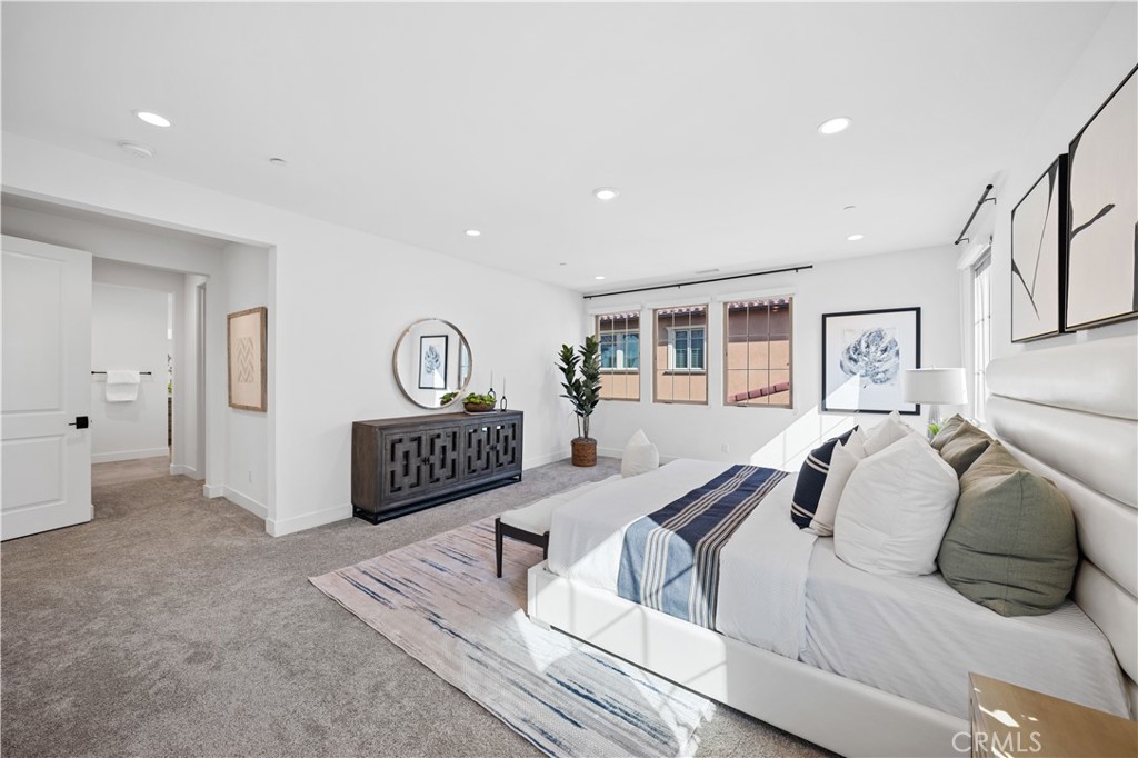 210 Sutters Mill Irvine, CA 92602 - Photo 36 of 46 a bedroom with a bed a couch and dresser