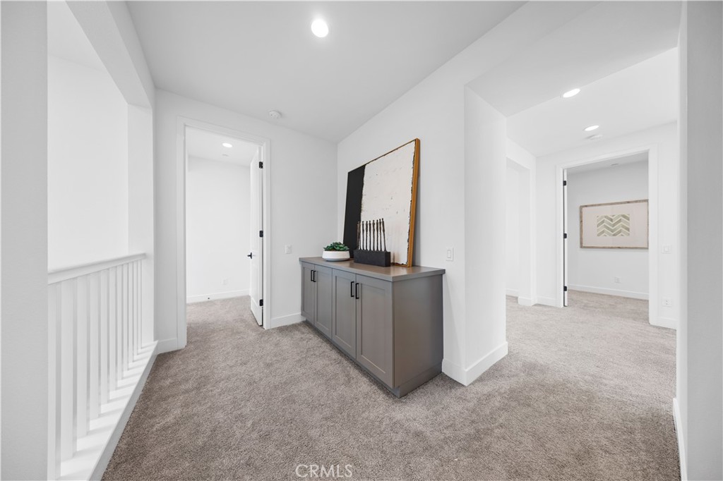210 Sutters Mill Irvine, CA 92602 - Photo 40 of 46 a view of a kitchen with refrigerator stove and wooden floor