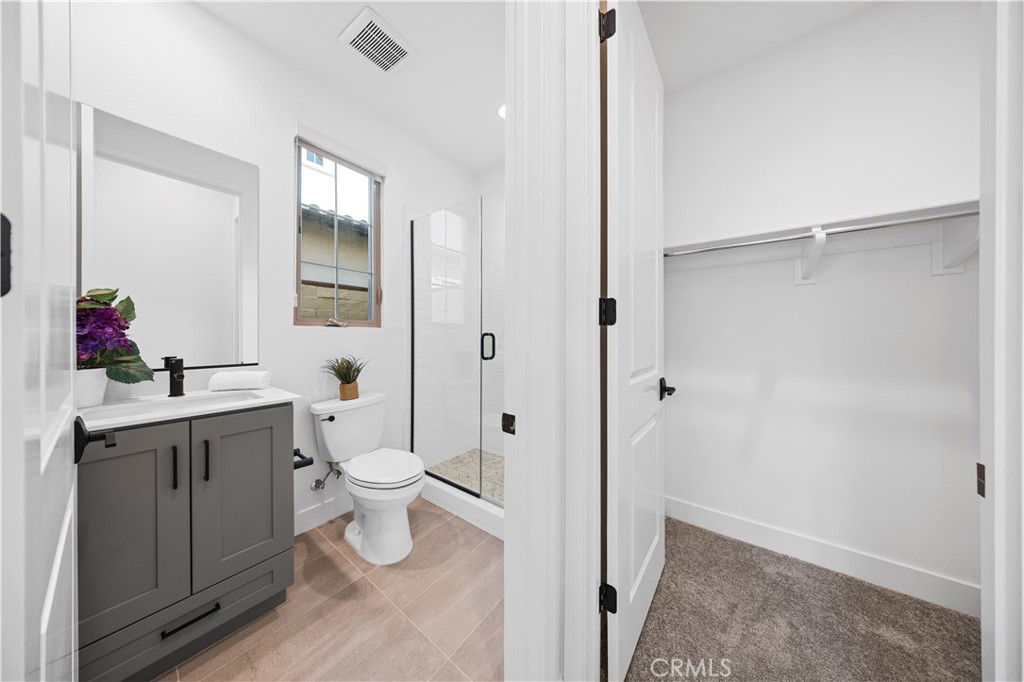 210 Sutters Mill Irvine, CA 92602 - Photo 4 of 46 a bathroom with a toilet sink and mirror
