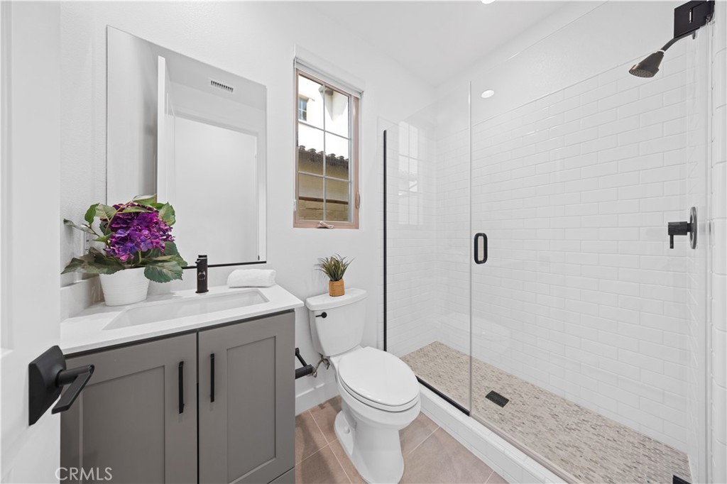 210 Sutters Mill Irvine, CA 92602 - Photo 5 of 46 a bathroom with a sink toilet and shower