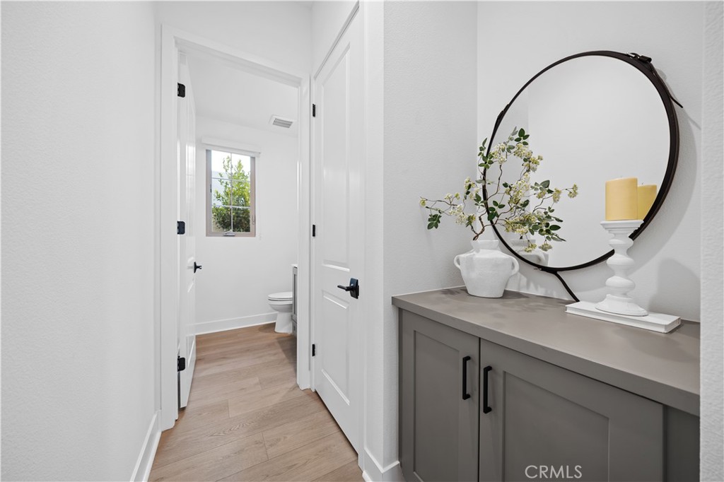 210 Sutters Mill Irvine, CA 92602 - Photo 8 of 46 a view of a bathroom with a sink and a mirror