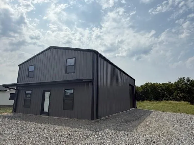 a backyard of a house with lots of green space