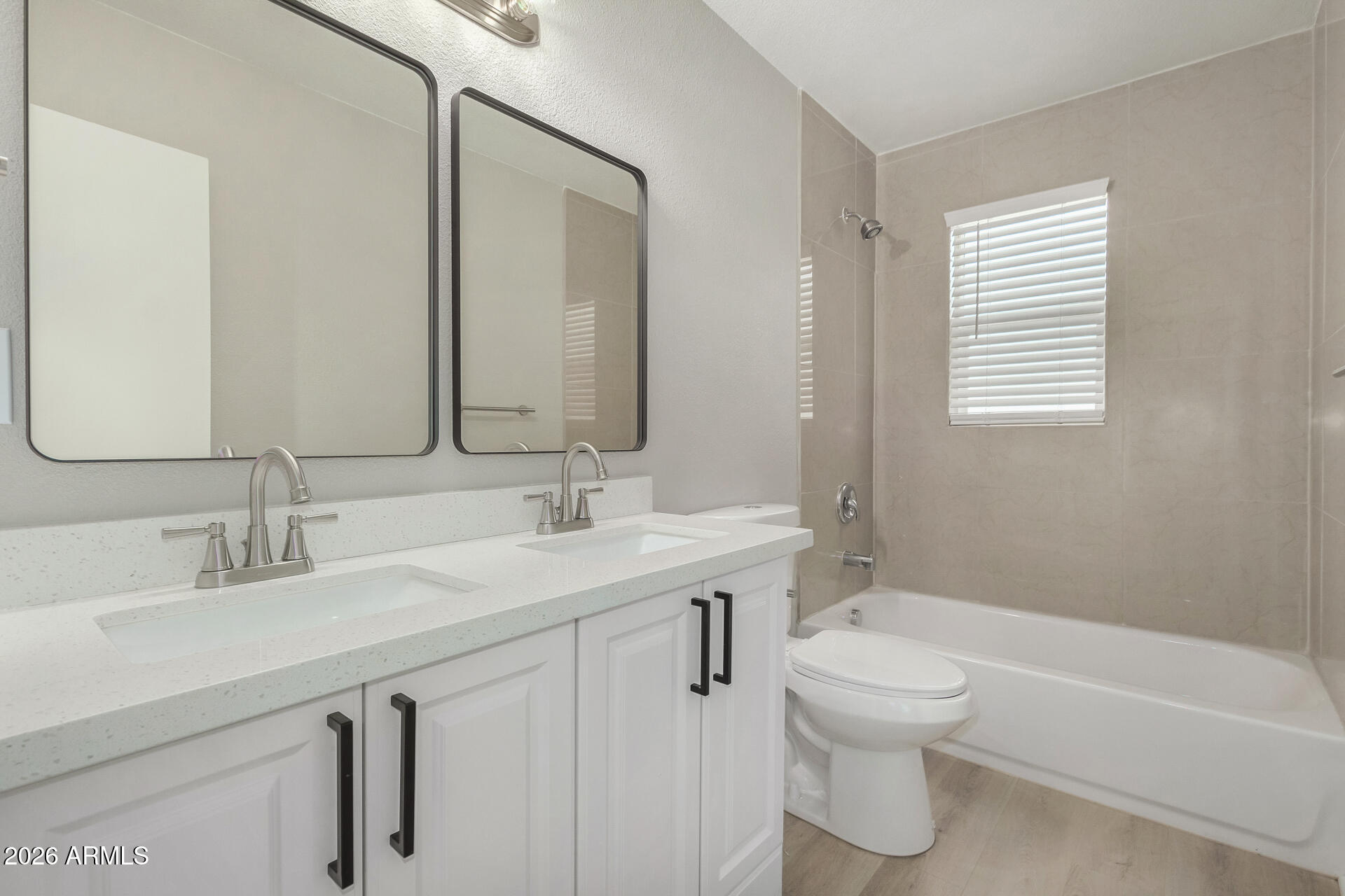 4911 East Culver Street Phoenix, AZ 85008 - Photo 15 of 26 a bathroom with a sink a toilet and shower