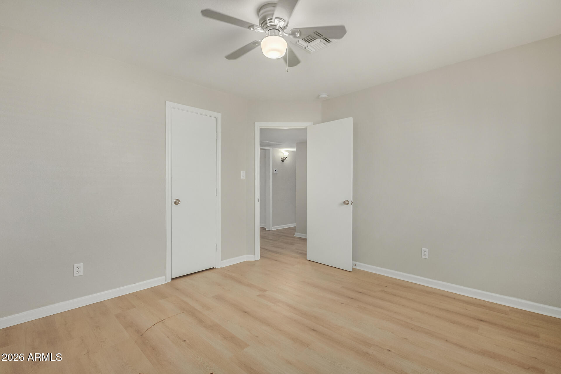 4911 East Culver Street Phoenix, AZ 85008 - Photo 17 of 26 a view of an empty room and chandelier fan