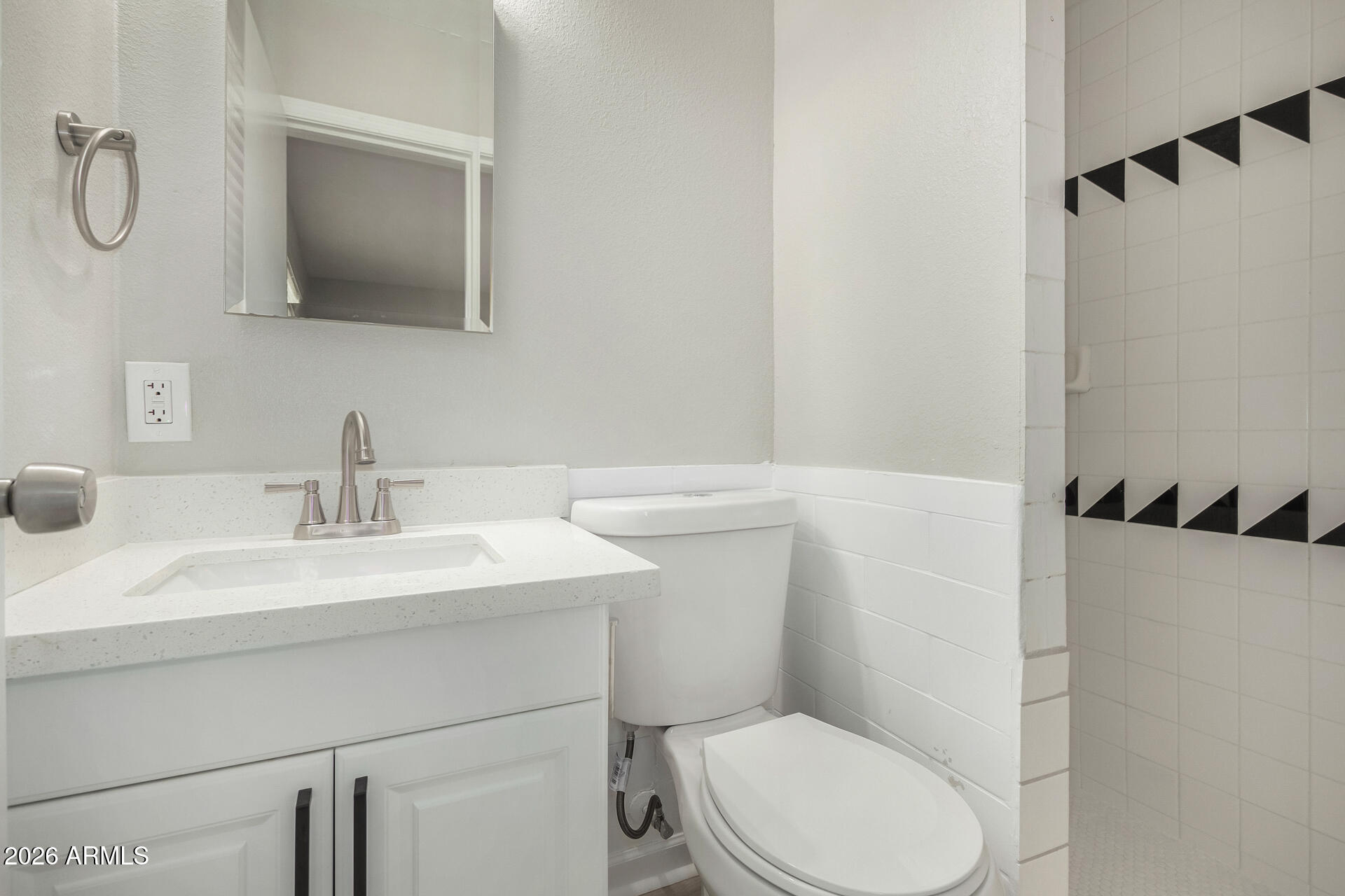 4911 East Culver Street Phoenix, AZ 85008 - Photo 20 of 26 a bathroom with a sink a toilet and a mirror