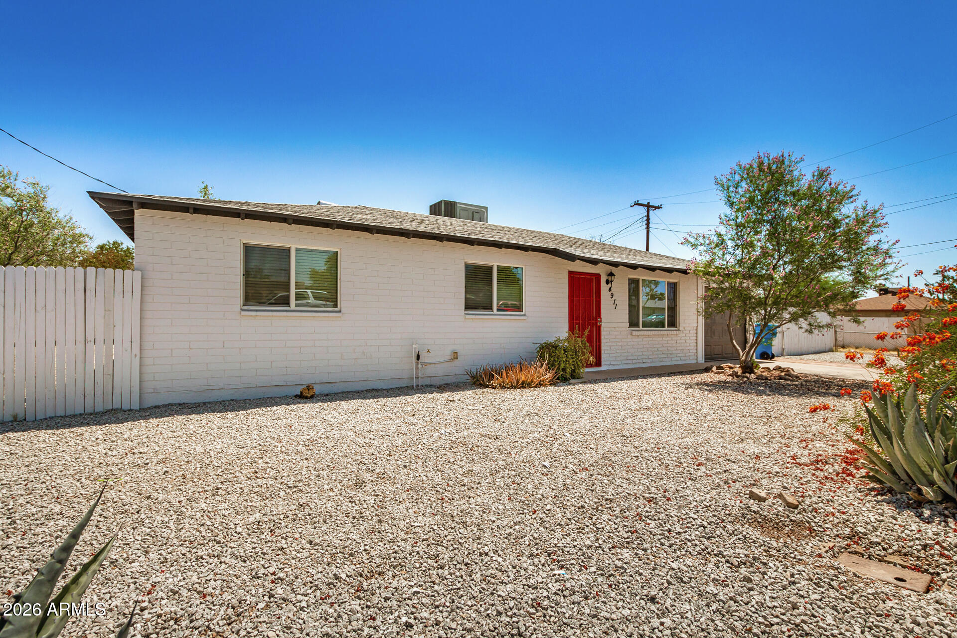 4911 East Culver Street Phoenix, AZ 85008 - Photo 2 of 26 a backyard of a house with garage
