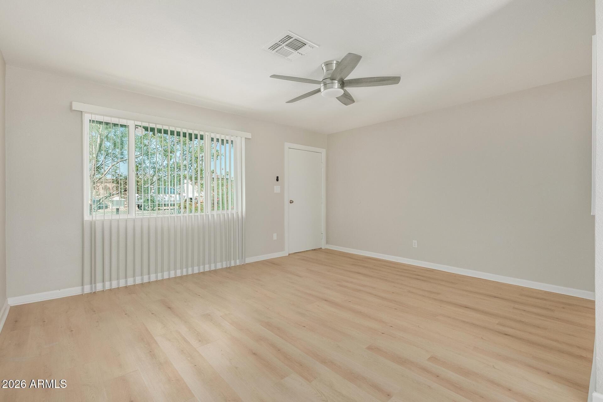4911 East Culver Street Phoenix, AZ 85008 - Photo 6 of 26 a view of an empty room with a window