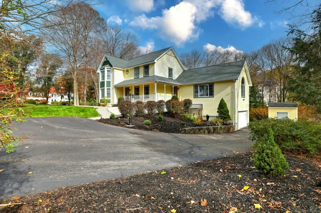 a front view of a house with garden