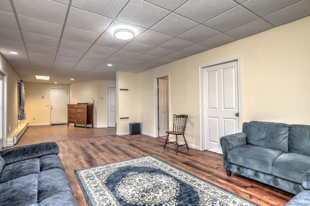 a living room with furniture and a rug