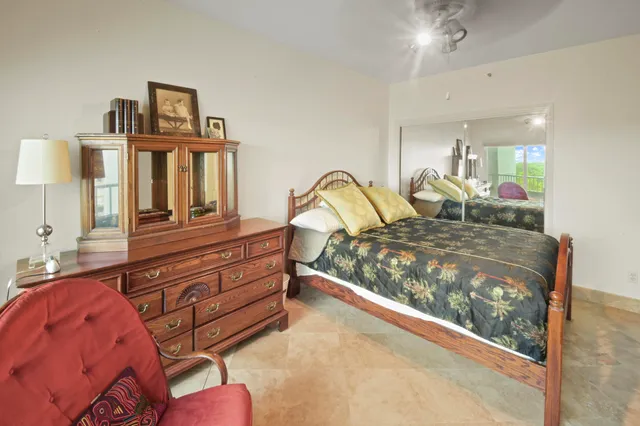 a bed room with a bed and a large window