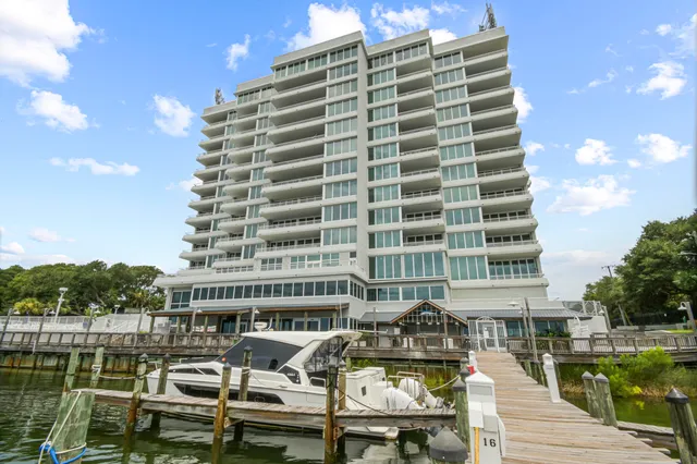 a front view of a building with glass top table and chairs
