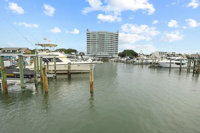 a view of a water with dining table and chairs