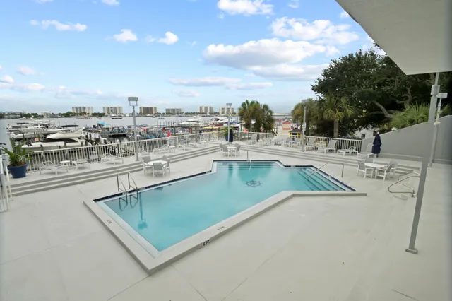 swimming pool view with a outdoor seating space