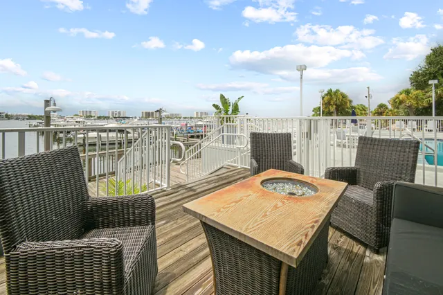 a terrace with outdoor seating and city view