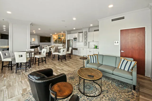 a view of a dining room with furniture and wooden floor