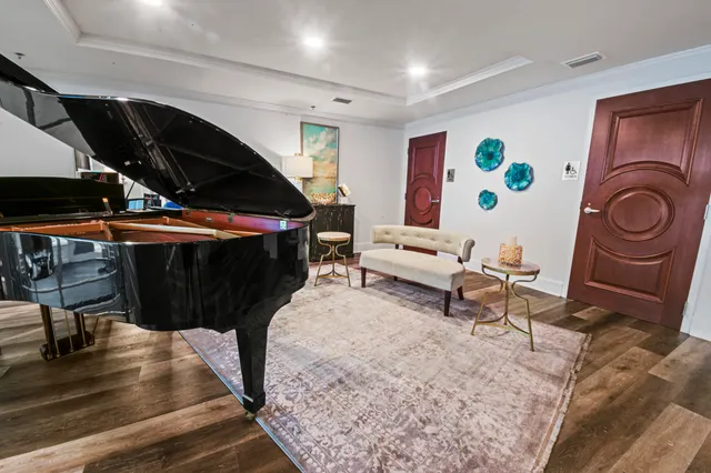 a living room with furniture and a rug