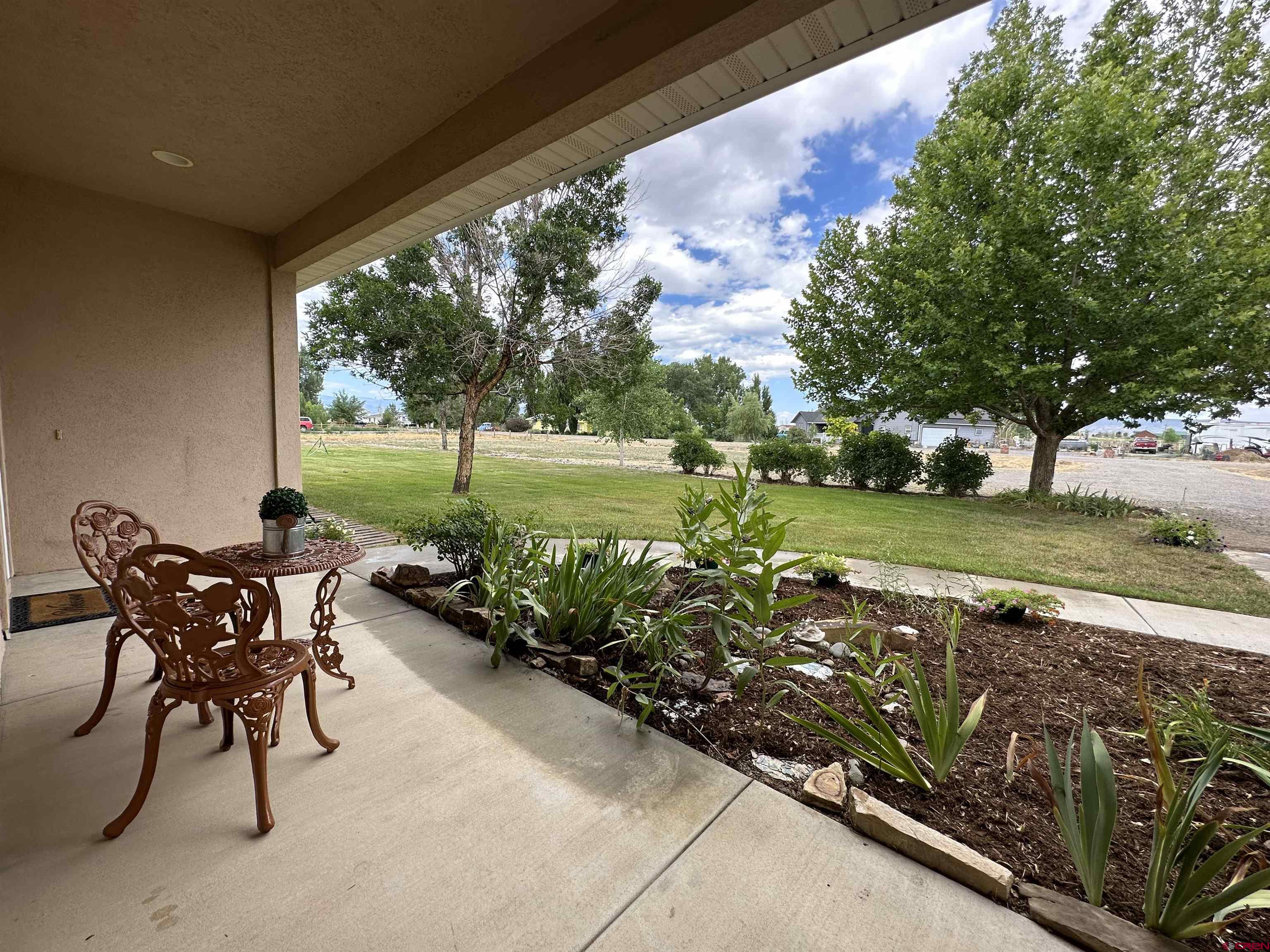 3821 1940th Road Delta, CO 81416 - Photo 6 of 35 a view of a chairs and table on the terrace
