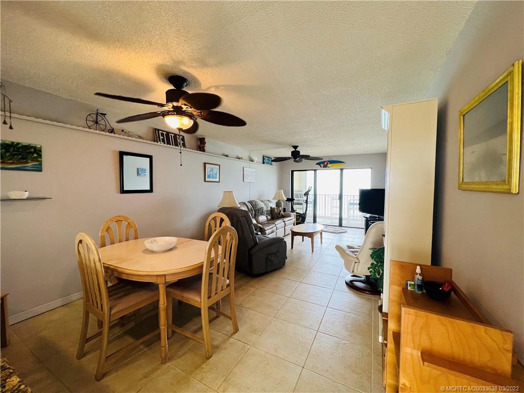7430 South Ocean Drive, Unit 619B Jensen Beach, FL 34957 - Photo 11 of 57 a dining room with furniture and chandelier