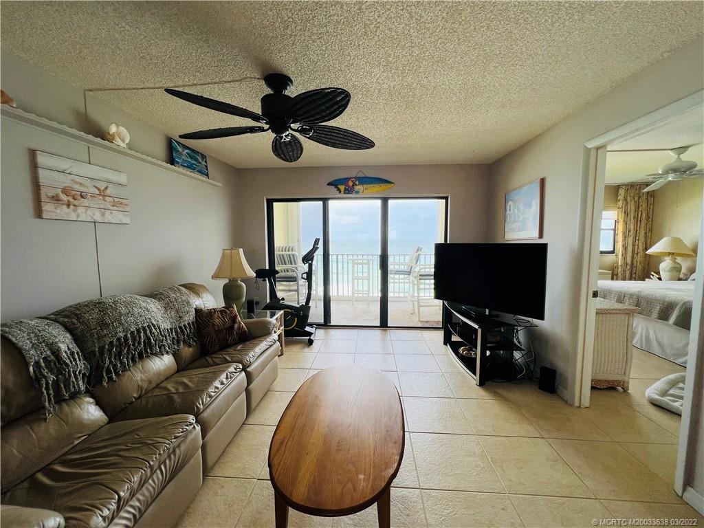 7430 South Ocean Drive, Unit 619B Jensen Beach, FL 34957 - Photo 15 of 57 a living room with furniture and a flat screen tv