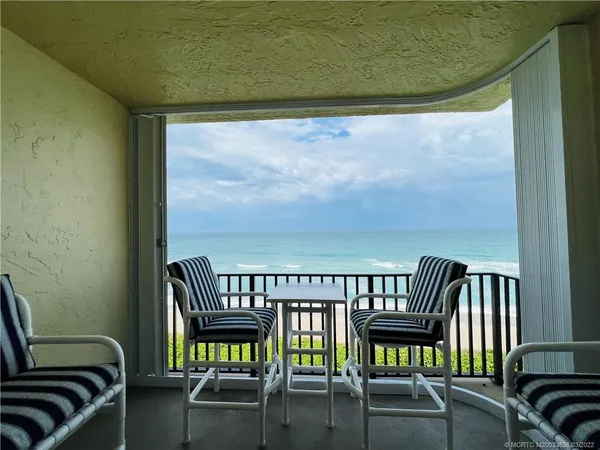 a view of a balcony with chairs