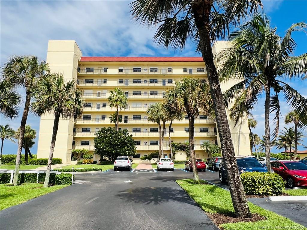 7430 South Ocean Drive, Unit 619B Jensen Beach, FL 34957 - Photo 2 of 57 front view of a building with a garden