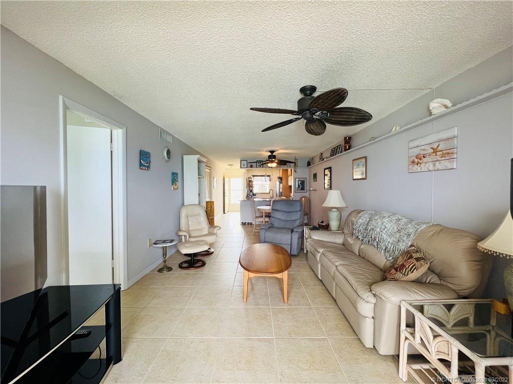 7430 South Ocean Drive, Unit 619B Jensen Beach, FL 34957 - Photo 25 of 57 a living room with furniture and a ceiling fan