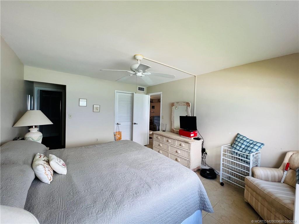 7430 South Ocean Drive, Unit 619B Jensen Beach, FL 34957 - Photo 29 of 57 a bedroom with a bed and a couch