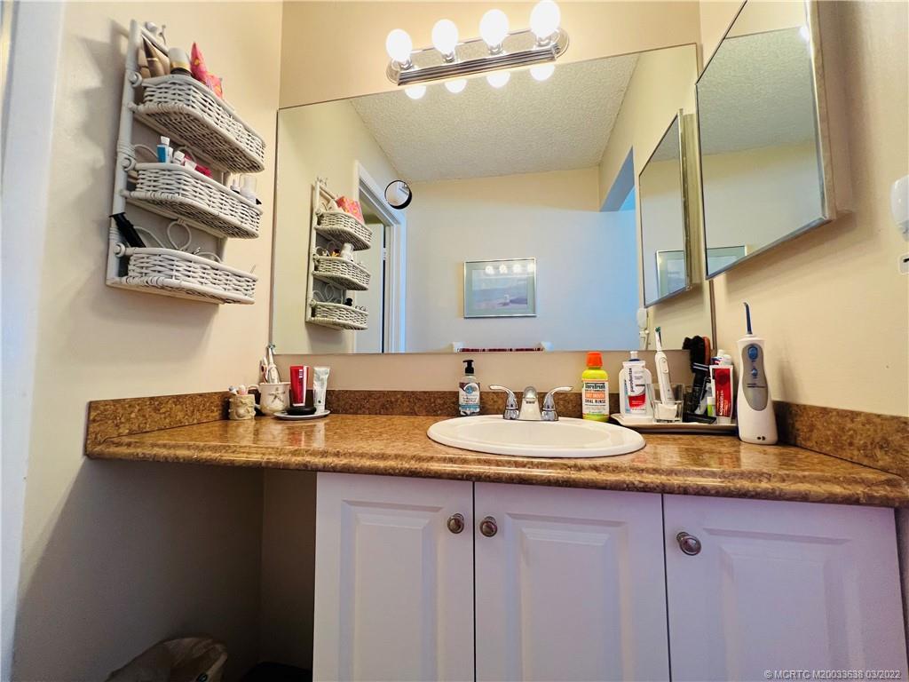 7430 South Ocean Drive, Unit 619B Jensen Beach, FL 34957 - Photo 33 of 57 a bathroom with a sink and a mirror