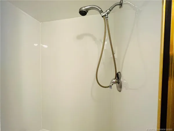 a view of a hallway with washer and dryer