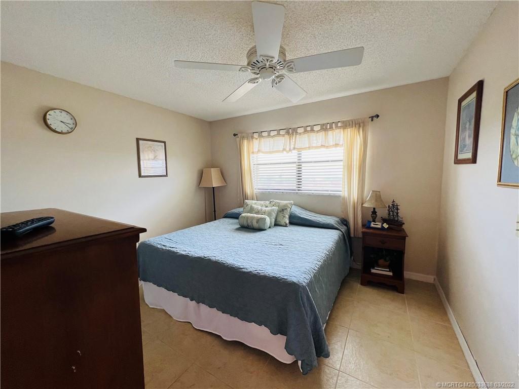 7430 South Ocean Drive, Unit 619B Jensen Beach, FL 34957 - Photo 37 of 57 a bedroom with a bed and window