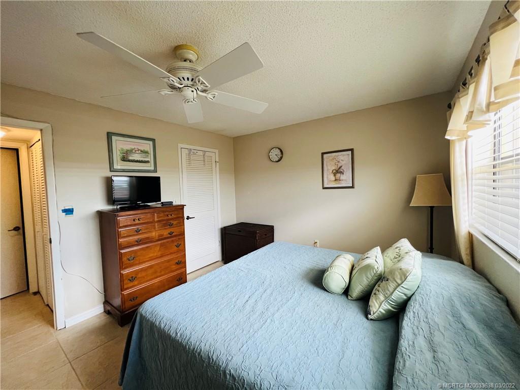 7430 South Ocean Drive, Unit 619B Jensen Beach, FL 34957 - Photo 38 of 57 a bedroom with a bed and a flat screen tv