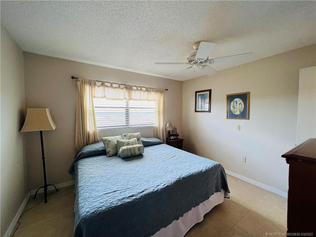 7430 South Ocean Drive, Unit 619B Jensen Beach, FL 34957 - Photo 39 of 57 a bedroom with a bed and a window