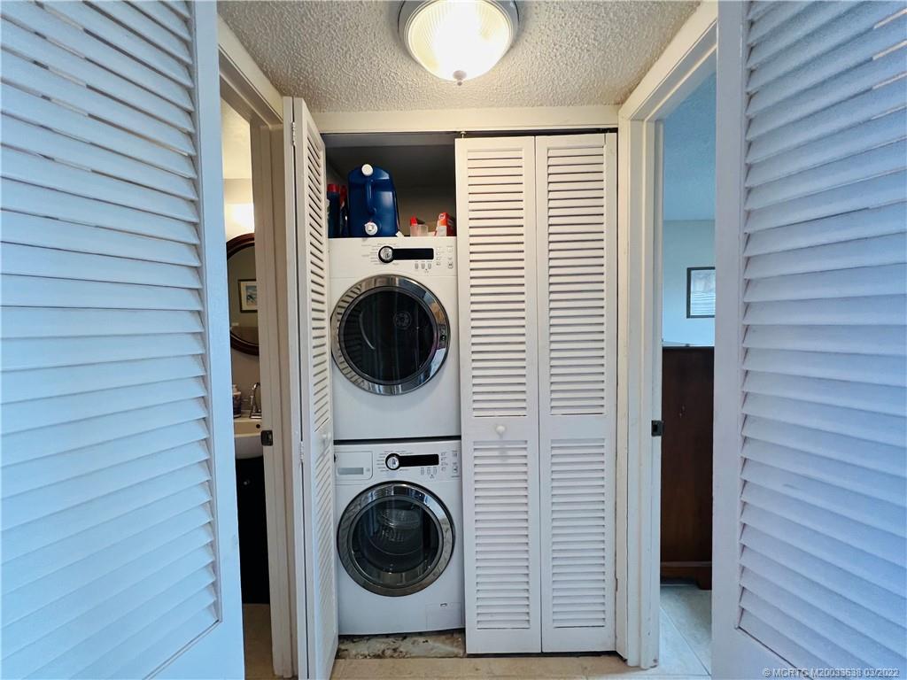 7430 South Ocean Drive, Unit 619B Jensen Beach, FL 34957 - Photo 41 of 57 a view of a hallway with washer and dryer