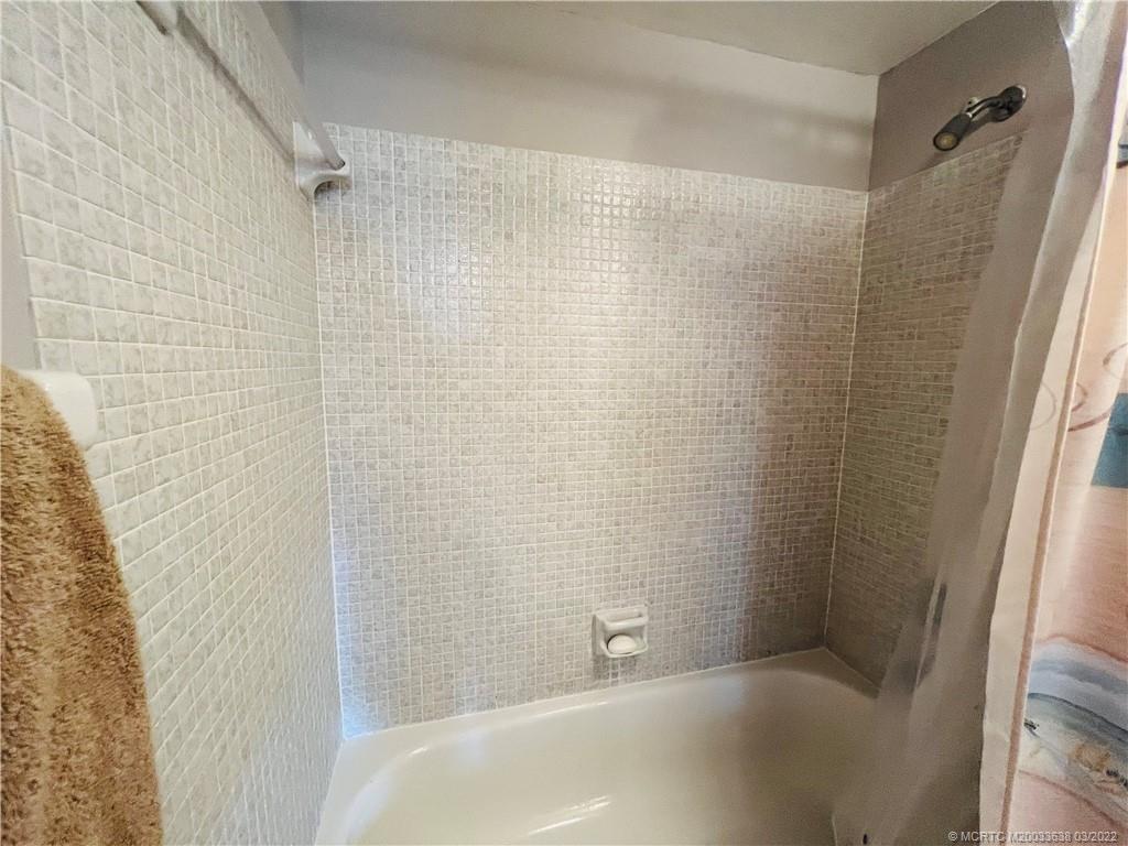 7430 South Ocean Drive, Unit 619B Jensen Beach, FL 34957 - Photo 43 of 57 a bathroom with a bathtub