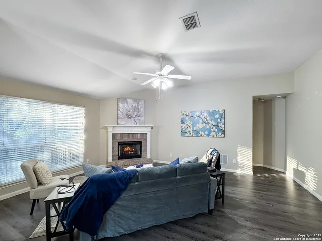 a living room with furniture and a fireplace