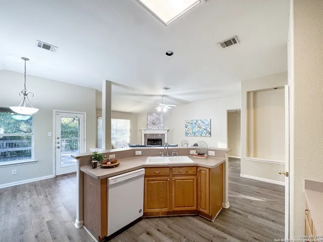 a kitchen with a sink stove and cabinets