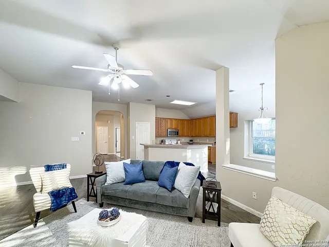 a living room with furniture and a large window