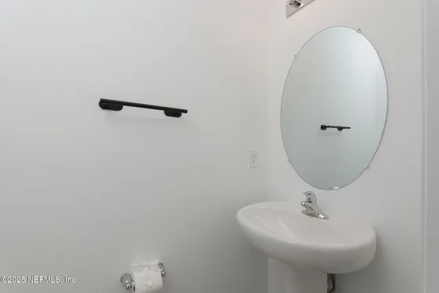 a view of a hallway with white walls