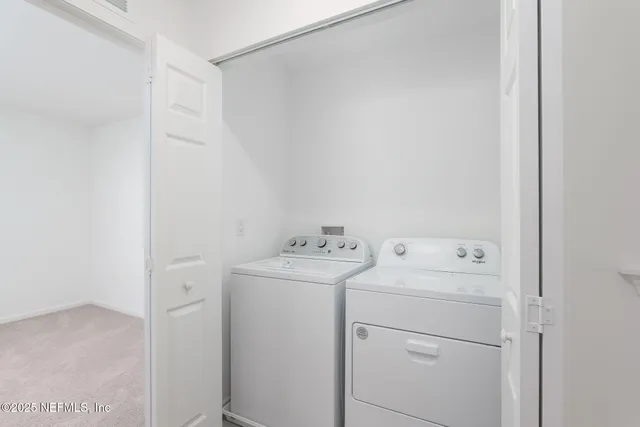 a bathroom with a toilet a sink and a window