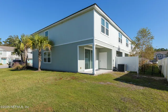 a front view of a house with swimming pool having outdoor seating